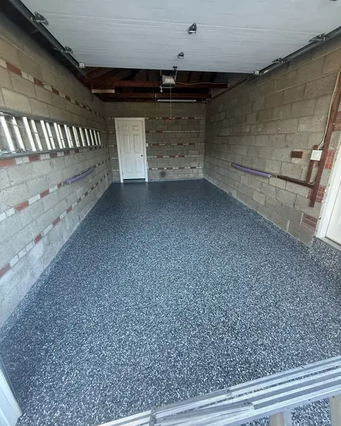 Single garage with a dark blue-grey flake epoxy floor